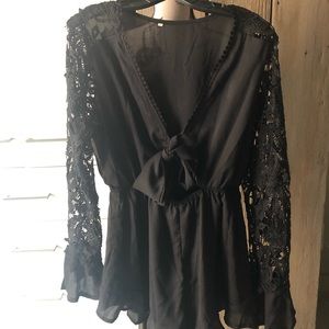 Short black romper with tie front and lace sleeves